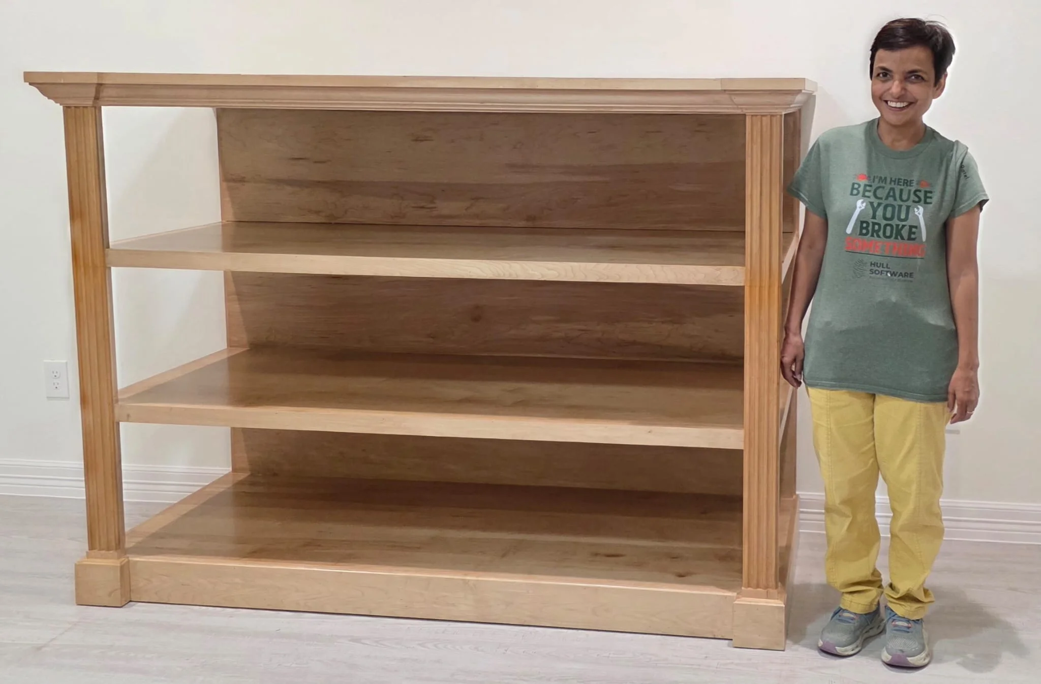 The completed wooden Buddhist shrine standing at 53 inches tall next to a person showing the safe height